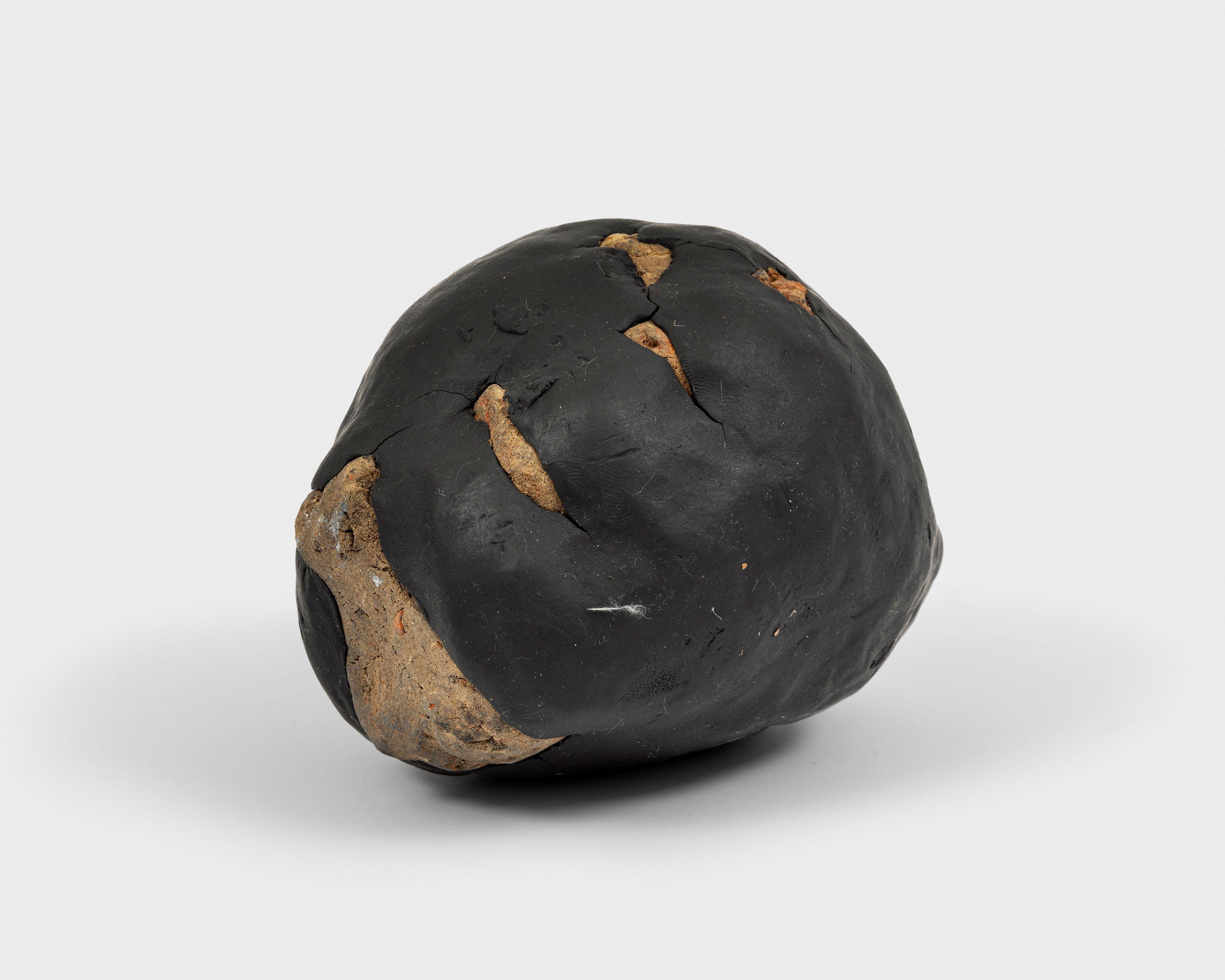 Model (Black Hand Holding Stone), from Working Table objects